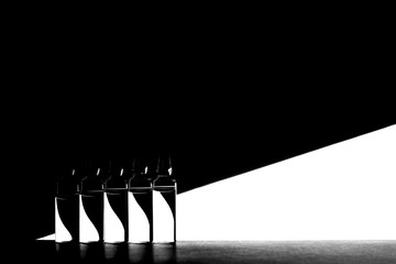 Ampules with vaccine on a geometric black and white background.