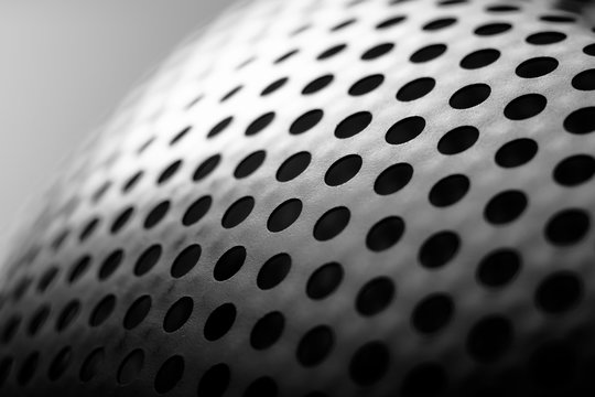Abstract surface with round holes in black and white. Black and white minimalism. © Azazello