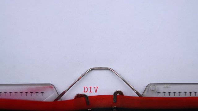 Divorce etymolofy - phrase printed on an old typewriter in red letters, close up. vintage inscription