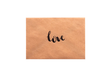 Brown color envelope with hand writing word "love"
