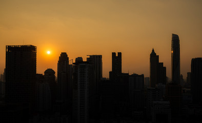 Fototapeta na wymiar City silhouette against the sky on a sunset. Bangkok city. 