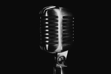 Retro silver microphone on black background