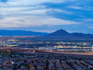 Dusk high angle view of the Frenchman Mountain and cityscape from Henderson View Pass