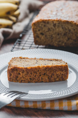Freshly Baked Banana Cake with Sliced Cake on Plate- Close Up  with Fork Vertical