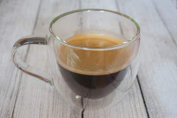cup of coffee on wooden table