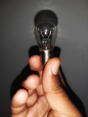 Bulb in a man's hand.