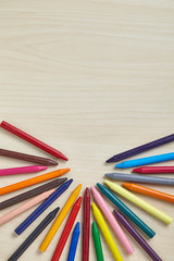 Colorful crayon on wooden table