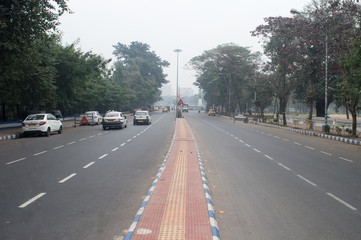 City street landscape in a winter foggy morning. Kolkata India South Asia Pacific February 2020