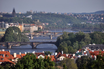 Fototapeta na wymiar Panorama of numerous bridges over the Vltava River in Prague. A fine summer day in the Czech Republic.