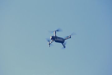 closeup drone flying on a blue sky background