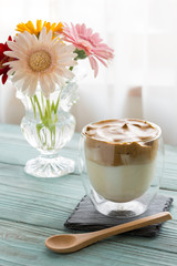 Whipped dalgona coffee on a wood background - ダルゴナコーヒー