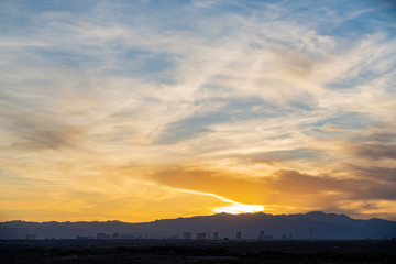 Sunset view of the beautiful strip skyline with red clouds