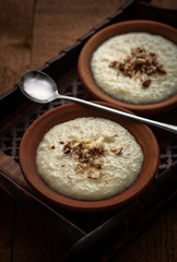 Phirni, a traditional and delicious indian style milk and rice based creamy dessert, served in clay pot