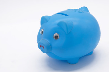 Blue piggy bank or money box isolated on a white background