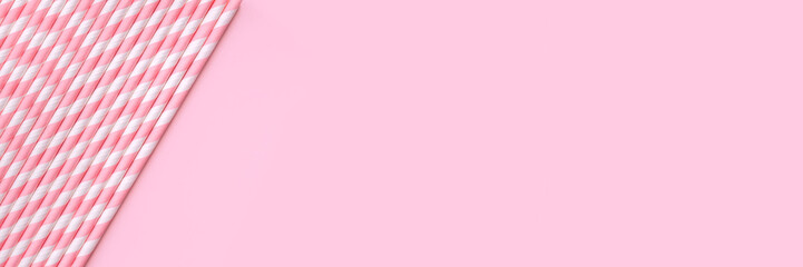 Banner with pastel paper straws with white stripes on soft pink background. Festive zero waste...