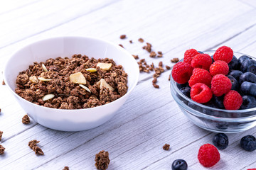 Muesli with berries on the wooden table