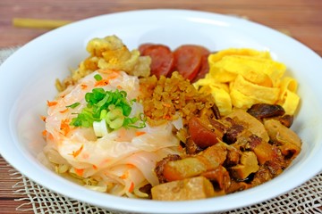 Chinese steamed rice noodles with pork, tofu, squid, egg, Shiitake mushrooms, Chinese sausage.