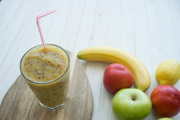 smoothies from kiwi on a wooden background