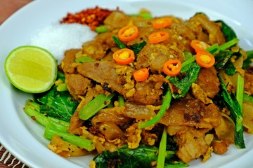 Stir fried flat noodle and pork with preserved soy bean paste.