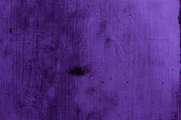 Purple colored abstract wall background with textures of different shades of purple or violet