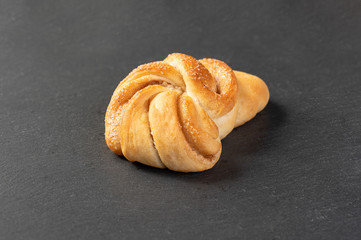 sweet, homemade cake with cinnamon on dark background