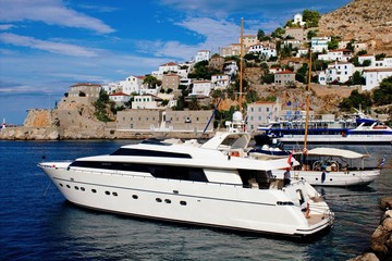 Fototapeta na wymiar A yacht at the port of Hydra island, Greece, September 26 2015.