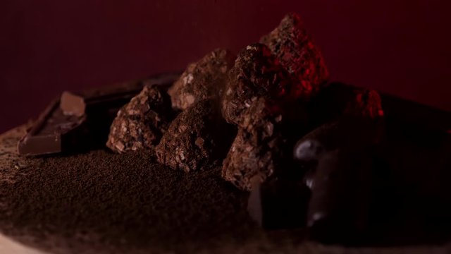 Close up chocolate bars with truffles daark food video 4K