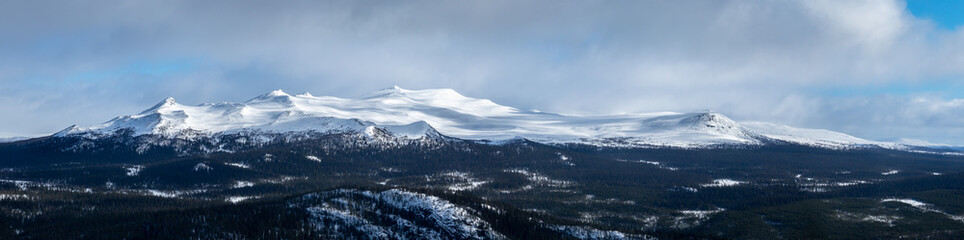 Winter landscape with dramatic snowy mountains. Panorama
