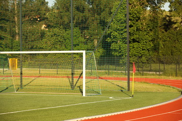 Jaslo, Poland - 7 9 2019: Goal on a football field with natural green grass in the open stadium of the city. A place for competitions and sporting events. Landscaping sports. Outdoor activities