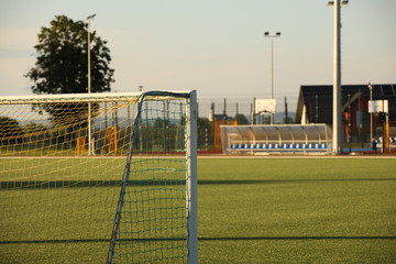 Fototapeta premium Jaslo, Poland - 7 9 2019: Goal on a football field with natural green grass in the open stadium of the city. A place for competitions and sporting events. Landscaping sports. Outdoor activities