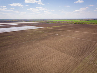 Drip Irrigation greenhouse Systems In An Agricultural Field Image. Aerial drone shot.