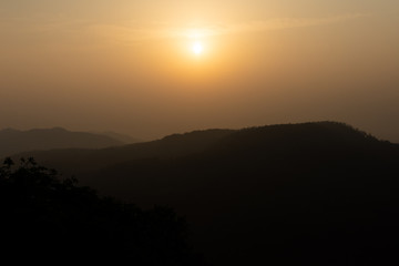 Golden sunrise on the mountain range of yercaud in Tamil Nadu India.