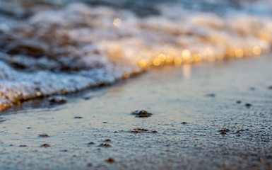 Summer. Sea. Sandy beach and fine sand. Small waves. Background.