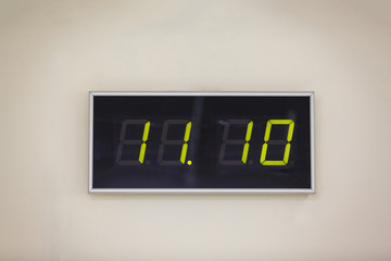 Black digital clock on a white background showing time 11:10