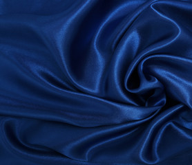 Smooth elegant blue silk or satin luxury cloth texture as abstract background. Luxurious Christmas background or New Year background design