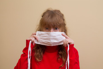 middle-aged woman with medical mask on her face, prevention against viruses and infections