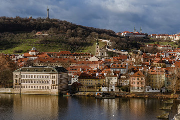 Fototapeta na wymiar Prague Houses and Hills View from Riverbank