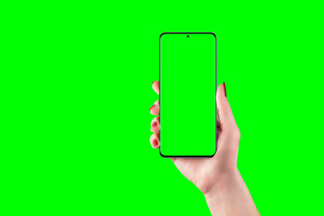 Phone mockup in woman hand with isolated screen and background in chroma key green