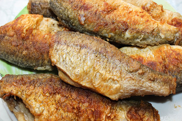 Fried Golden river fish on a plate.