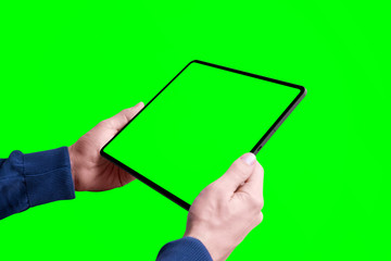 Tablet mockup in man hands isolated in chroma key green