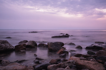 beautiful purple sunset on the sea coast