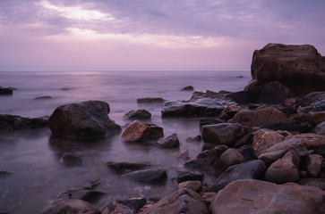 beautiful purple sunset on the sea coast