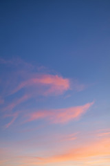Fototapeta na wymiar PInk sunset clouds with blue skies