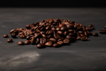 Composition with a coffee beans on a textured plastered background with a variety of arbitrary stains