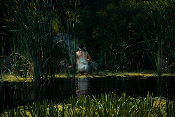 Swimming on holiday in the water of a lake or river with reeds