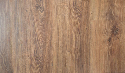 Naklejka premium Wooden brown textured floor or desk background and texture of Walnut wood decorative furniture surface