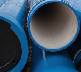 Stack of new blue pipes (tubes)
