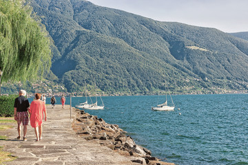 Couple passing at promenade in Ascona in Ticino Switzerland © Roman Babakin