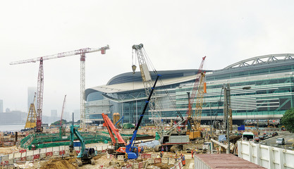Fototapeta premium Construction site with workers in center of Hong Kong