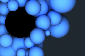 Blue balls of different sizes on a dark background. 